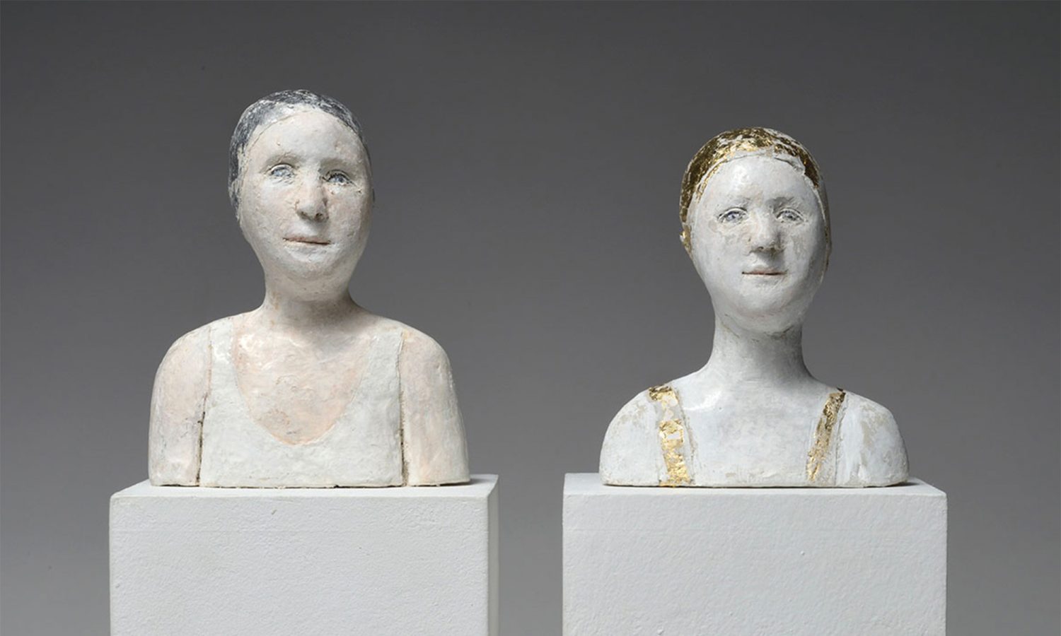 2 Small Portraits With Gold and Silver Caps